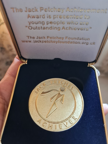 Medal with Jack Petchey Achiever engraved on it