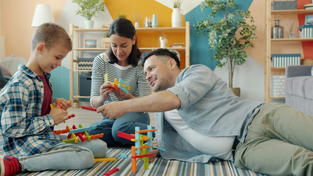 Child and parents playing with toys