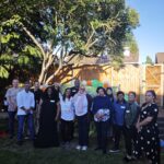 People standing together in a garden