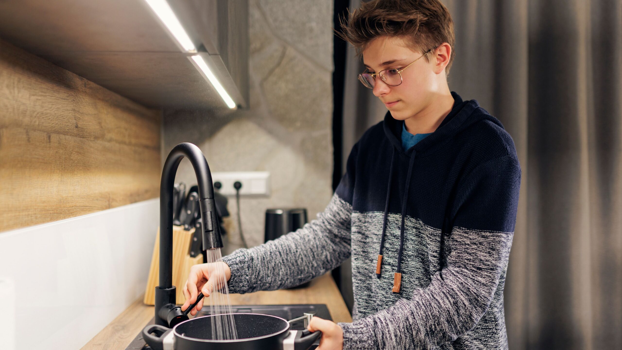Teenage boy cooking