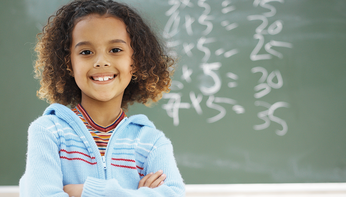 Child in front of blackboard