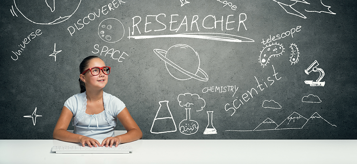 Child in front of blackboard