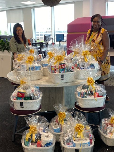 Aaliyah Shah and Jeanette Duncan from Slough Children First with a selection of hampers for care leavers